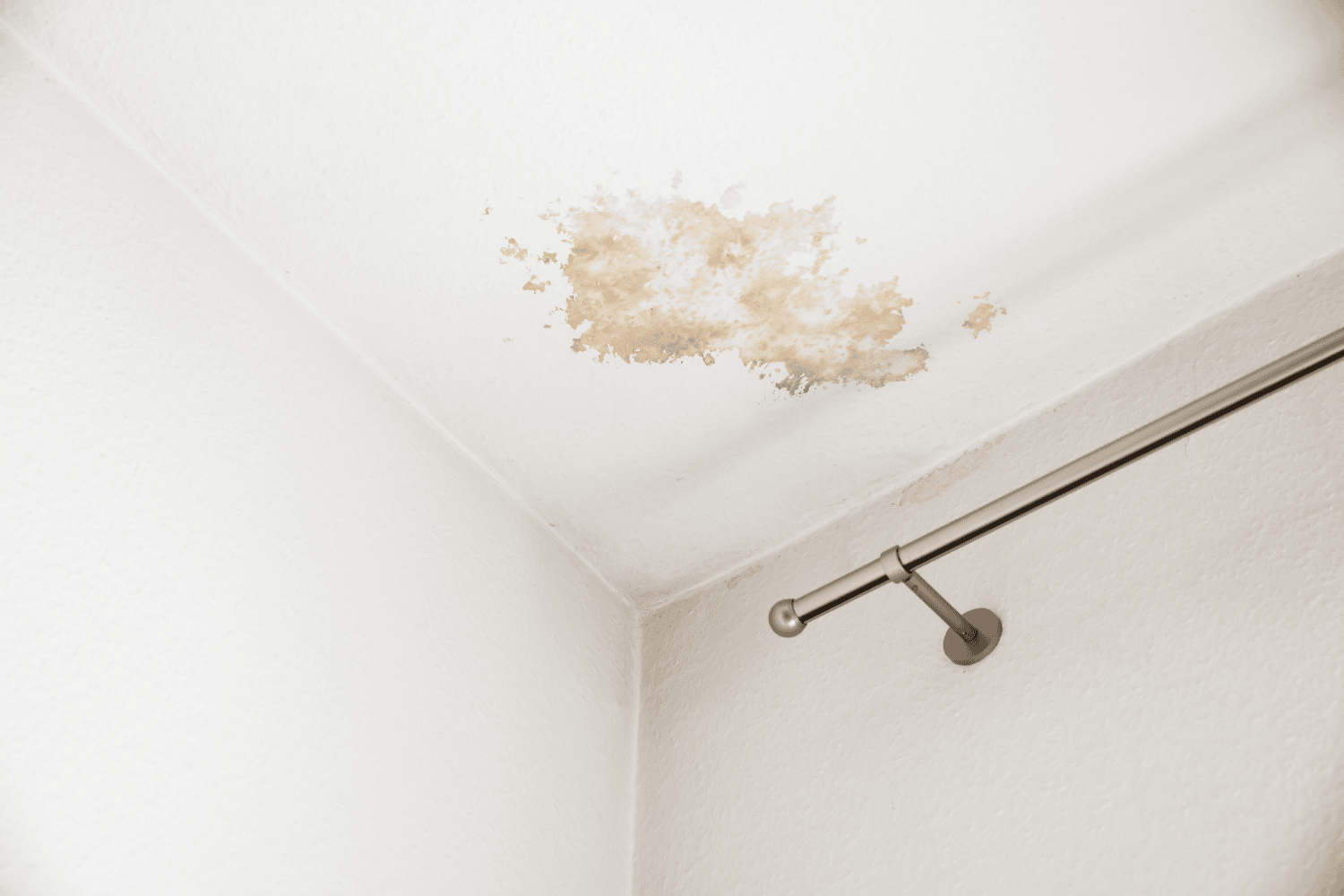 Signs of a leaking roof including water stains on the ceiling.