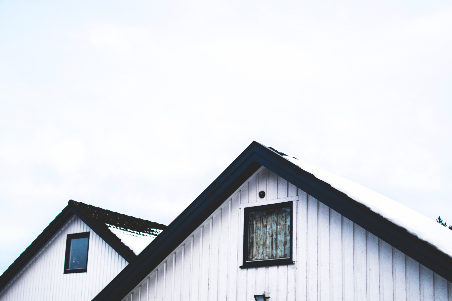 A professional inspecting a roof for timely repairs.