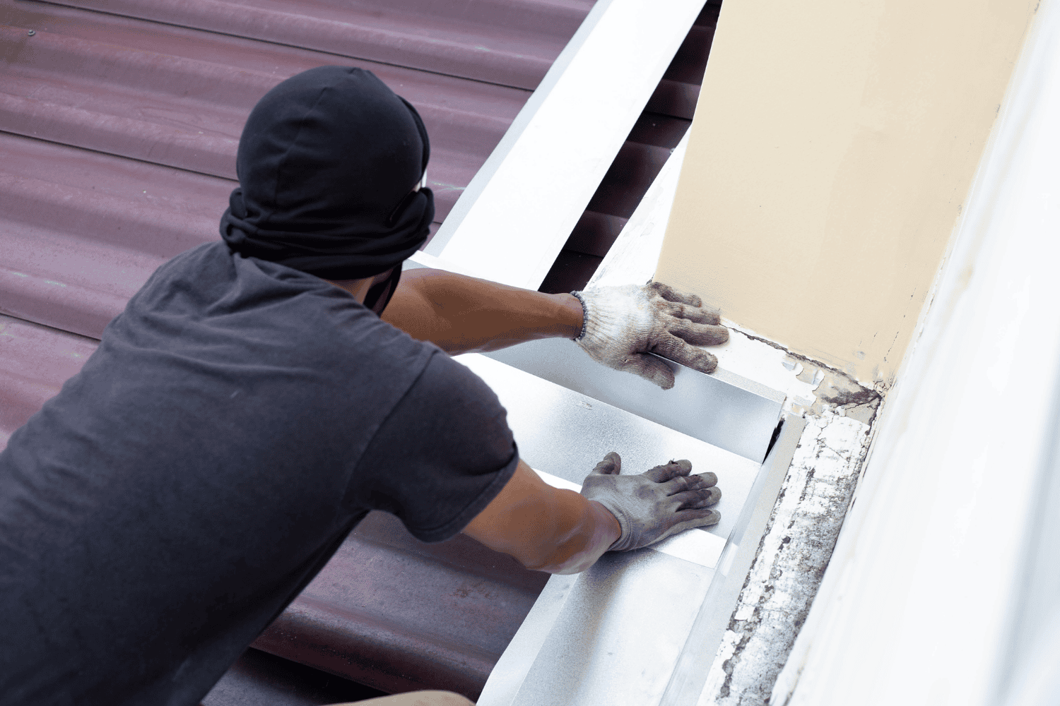 A DIY roofing repair process with roofing cement for small leaks.