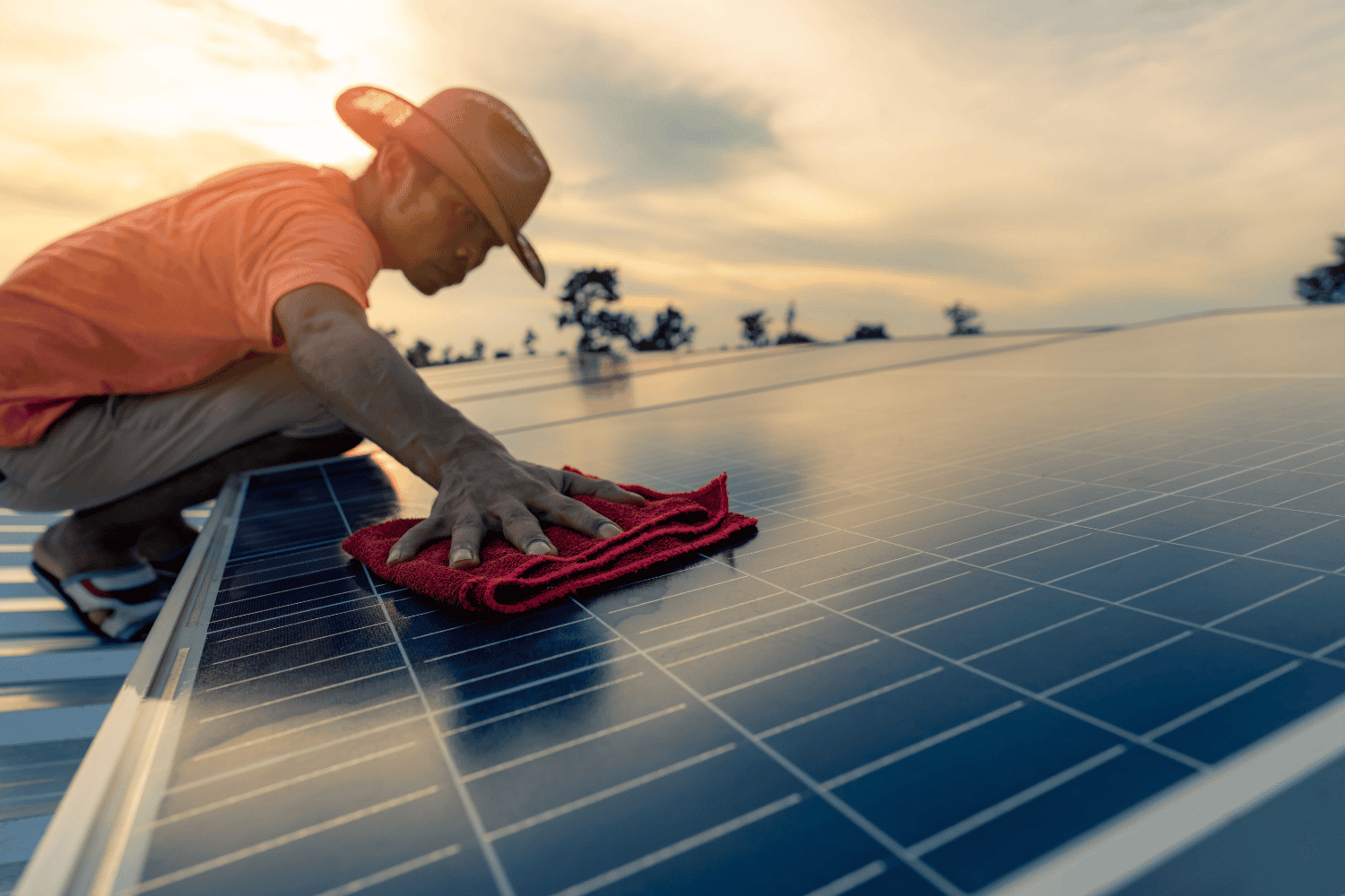 A technician performing maintenance on a solar system.