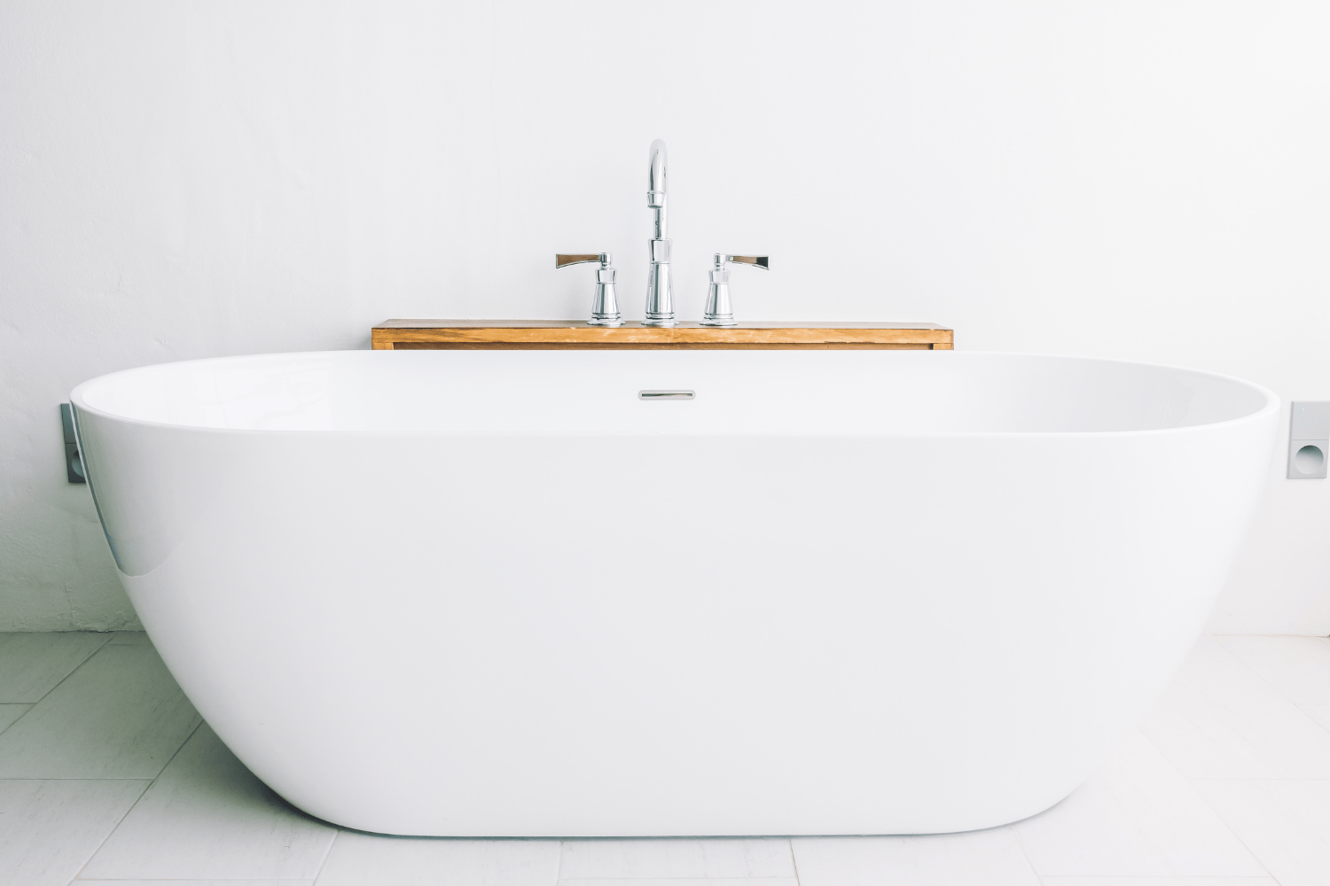 A beautifully remodeled bathroom showcasing a modern bathtub.