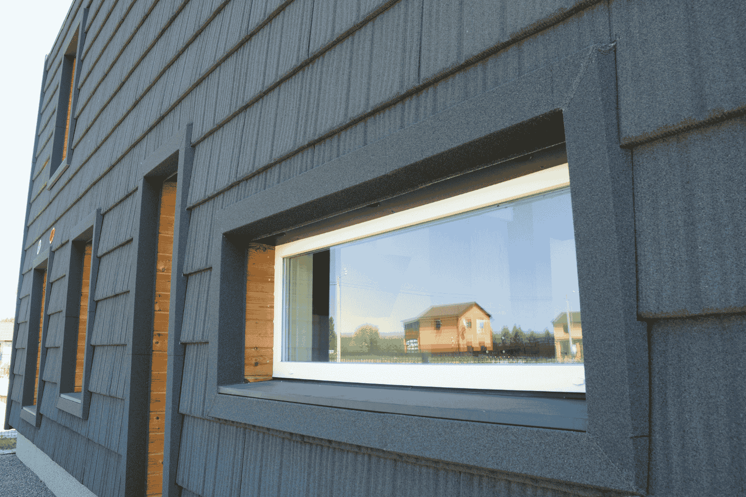 Different types of energy efficient glass showcased in a window display.